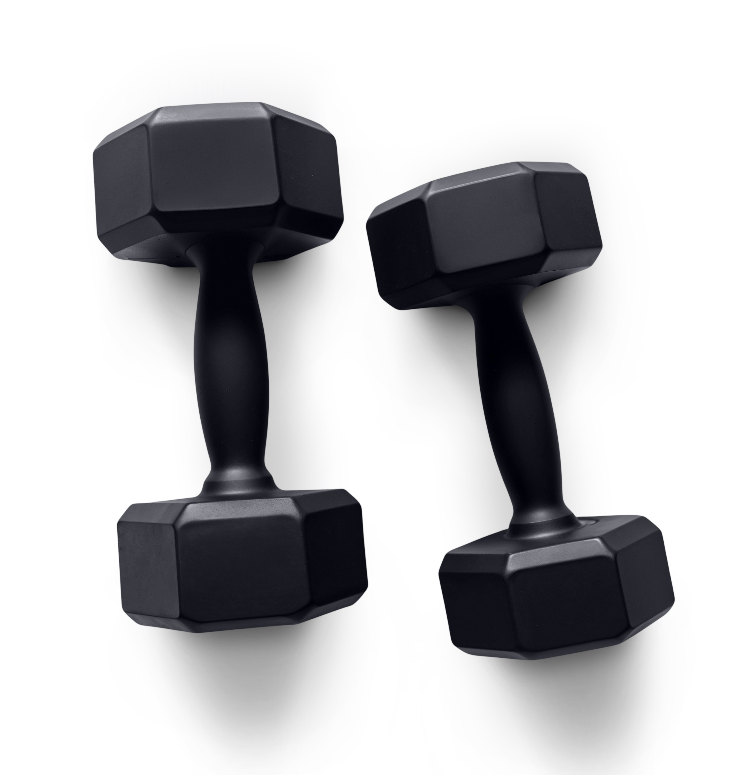 Dumbbells beside a workout notebook